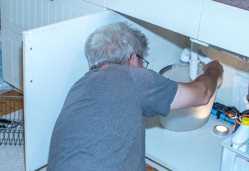 Plumber repairing a pipe